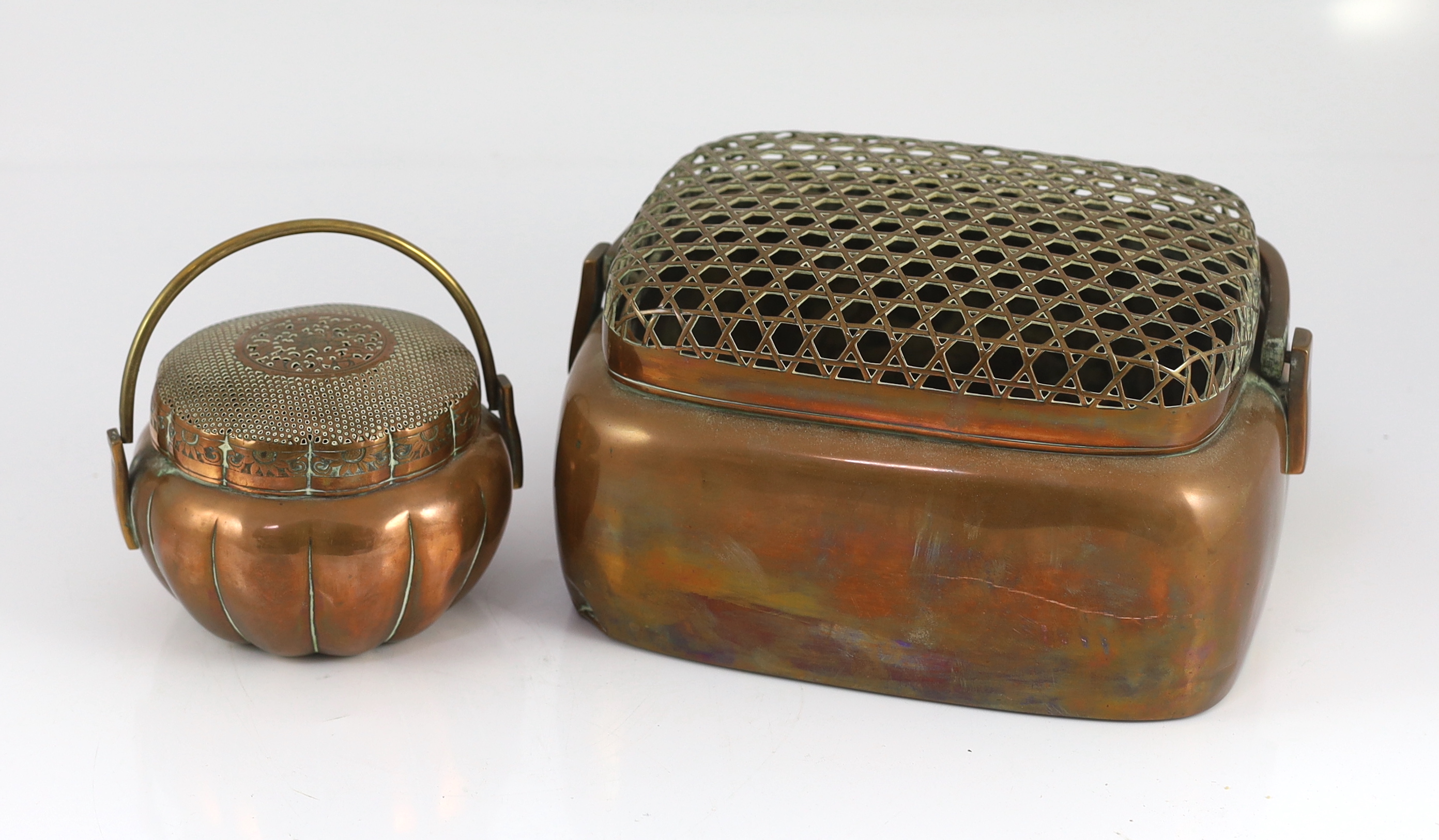 Two Chinese copper hand warmers, the largest signed ‘Zhang Mingqi', 18th/19th century